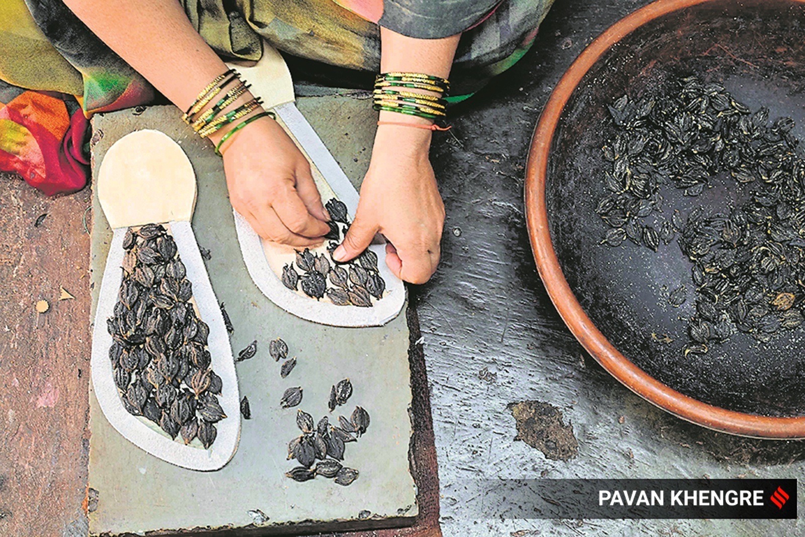 A worker makes the family kolhapuri sound champal