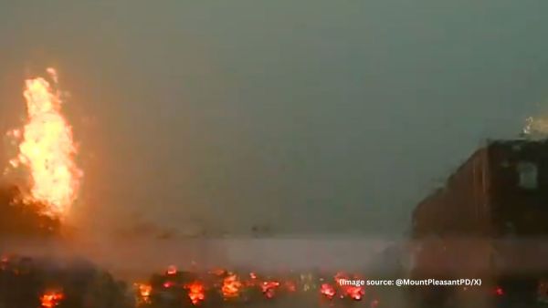 The footage shows the officer driving through slow-moving traffic just moments before the lightning struck (Image source: @MountPleasantPD/X)