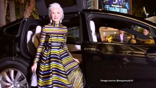 In the AI video, Maye Musk can be seen getting out of a car in a stunning multi-coloured striped gown (Image source: @mayemusk/X)