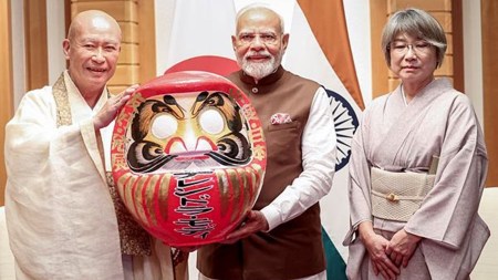 Prime Minister Narendra Modi being presented a Daruma Doll by Chief Priest of Shorinzan Daruma Temple, in Tokyo, Japan