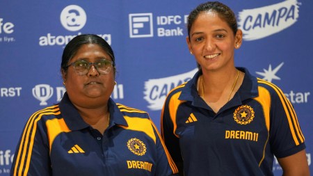 Indian women's cricket captain Harmanpreet Kaur, right, and Chief Selector Neetu David pose during the press conference to announce the team for Australia ODI Series and ICC Women's World Cup 2025 at the BCCI Headquarters in Mumbai, India, Tuesday, Aug. 19, 2025. (AP Photo/Rajanish Kakade)