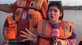 Pakistani reporter flood coverage