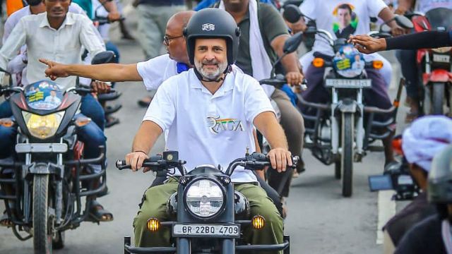 In this image posted on Aug. 24, 2025, Leader of Opposition in the Lok Sabha Rahul Gandhi rides a motorcycle during the ‘Voter Adhikar Yatra’, in Bihar