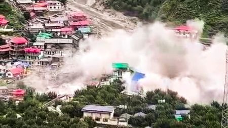Houses being swept away in a flash flood triggered by a cloudburst at Dharali, in Uttarkashi district, Uttarakhand