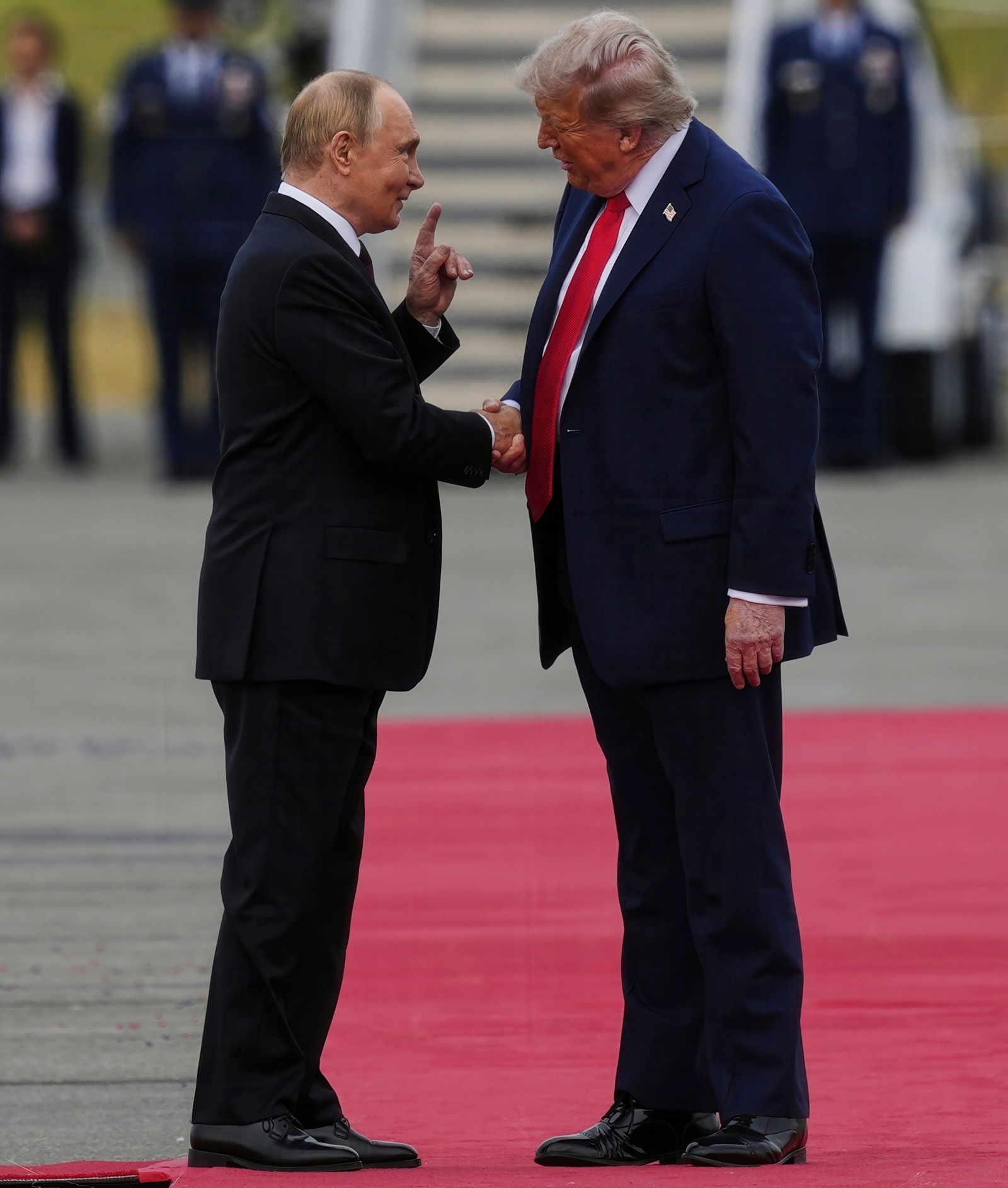 President Donald Trump greets Russia's President Vladimir Putin in Alaska on Friday