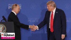 President Donald Trump shakes the hand of Russia's President Vladimir Putin during a joint press conference in Alaska on Friday
