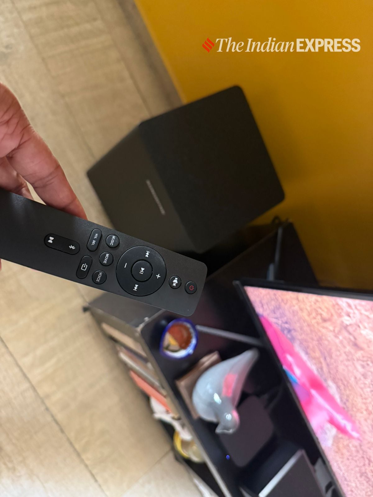 The minimalist remote makes it easy to toggle between sound modes, adjust bass, or activate Dolby Atmos in one click. (Image: Nandagopal Rajan/The Indian Express)
