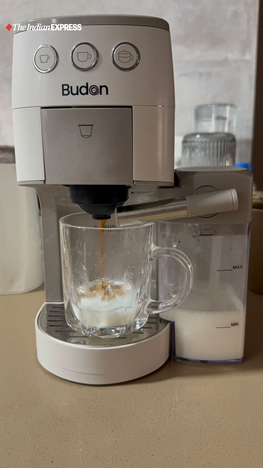 Brewing a cappuccino with freshly frothed milk using the Budan One Touch’s milk container. (Image: Nandagopal Rajan/The Indian Express)