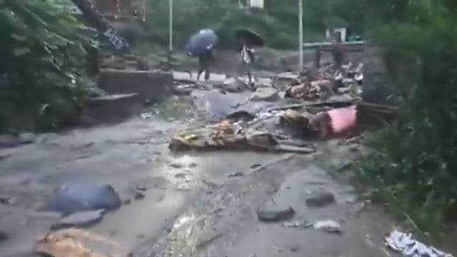 Debris deposited at the Tharali tehsil office and the surrounding houses after a rain drain gave in.