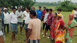Photo: Local gather at the site of the incident