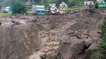 Houses damaged at an area after a massive cloudburst at Chasoti village