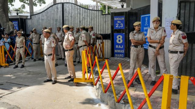 Police personnel outside Delhi CM Rekha Gupta's residence (PTI Photo)