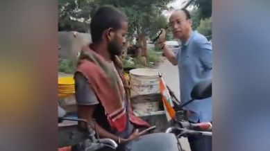 The video shows a man hitting and abusing another man feeding a stray dog. (File Photo)