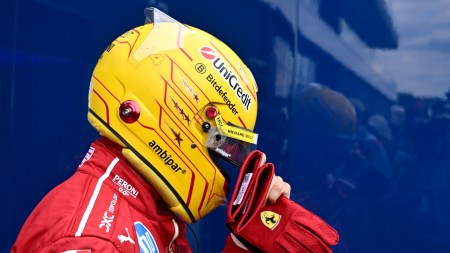 Ferrari driver Lewis Hamilton of Britain walks back to his pits after failing to complete during the qualifying session for the Hungarian Formula One Grand Prix at the Hungaroring racetrack in Mogyorod, Hungary, Saturday, Aug. 2, 2025. (AP Photo/Denes Erdos)