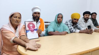 Chhinder Kaur, wife of late Balkar Singh, shows the scar of third-degree torture. Other family members of the victims speak to The Indian Express in Mohali on Monday, August 4, 2025. (Express photo by Jasbir Malhi)