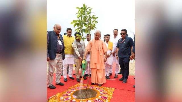 **EDS: THIRD PARTY IMAGE** In this handout image released on Aug. 21, 2025, Uttar Pradesh Chief Minister Yogi Adityanath waters a plant sapling during the inauguration of Shree Cement's plant, in Etah. (Handout via PTI Photo) (PTI08_21_2025_000068B)