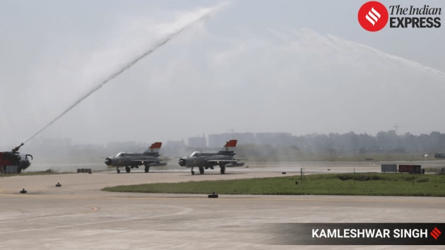 six MiG‑21 jets from No. 23 Squadron “Panthers,” accompanied by a water cannon salute upon landing