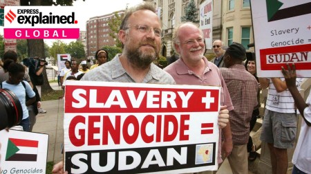 Founders of Ben & Jerry's Ice Cream Jerry Greenfield , left, and Ben Cohen, pink shirt, protest in front of Sudan's embassy July 29, 2004, in Washington.