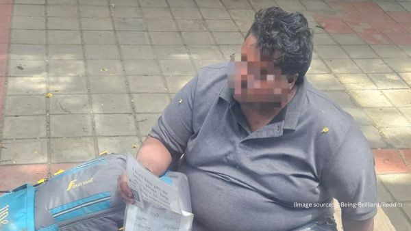 Along with the message, the Bengaluru man also held a smaller sheet with a QR code for financial contributions (Image source: @Being-Brilliant/Reddit)