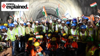 Workers celebrate the breakthrough for a tunnel as part of the Mumbai-Ahmedabad bullet train project.