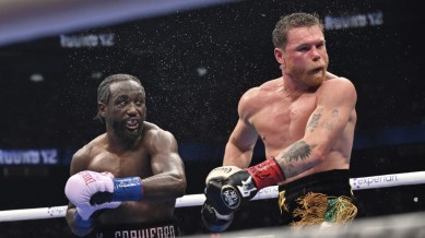Crawford defeated Alvarez unanimously to become the undisputed super middleweight champion in a thrilling contest at Allegiant Stadium in Las Vegas on Saturday. (AP)