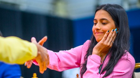 Divya Deshmukh accepts Egyptian grandmaster Amin Bassem's resignation in their round 4 game at the FIDE Grand Swiss tournament in Samarkand. (PHOTO: FIDE/Michal Walusza)