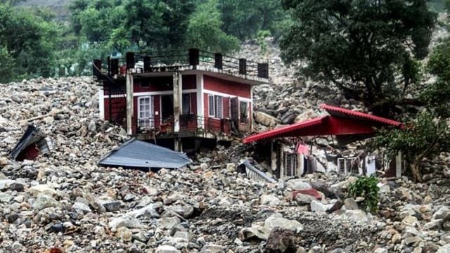 A house lies in ruins after a downpour triggered a cloudburst and landslides, at Sahastradhara, in Dehradun, Uttarakhand