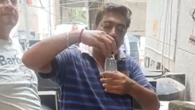 DJB workers coming on site to take samples and check the water quality on Sunday morning. (Screengrab from video)