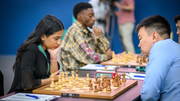 Sensing inevitable checkmating ideas from Sanan Sjugirov, Divya Deshmukh was forced to resign on the spot. (Photo: FIDE/Michal Walusza)