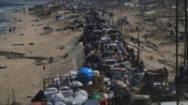 Displaced Palestinians flee northern Gaza along the coastal road toward the south, after Israel's military says its expanded operation in Gaza City has begun and warns residents to leave. (AP Photo)