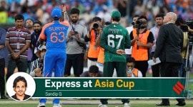 Pakistan's captain Salman Agha, right, watches as India's captain Suryakumar Yadav flips the coin at the toss ahead of the Asia Cup cricket match between India and Pakistan at Dubai International Cricket Stadium in Dubai, United Arab Emirates, Sunday, Sept. 14, 2025. (AP Photo/Altaf Qadri)
