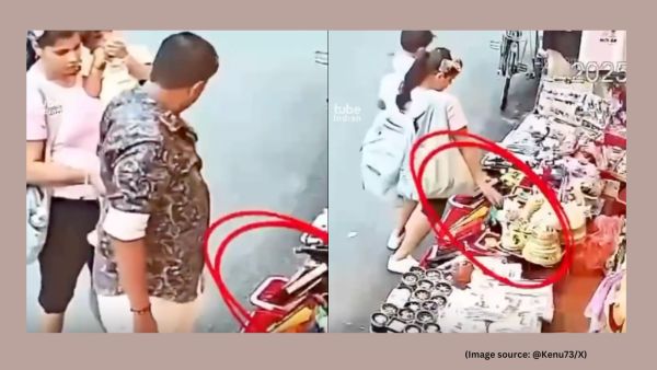The man slyly picks up an item from the ground and hands it to his wife, who is carrying a child (Image source: @Kenu73/X)