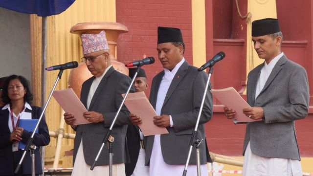 New Ministers, from left, Rameshwor Prassad Khanal, Minister of Finance, Kulman Ghising, Energy and irrigation Ministry, and Om Prakash Aryal Home Ministry attend an oath swearing ceremony in front of the presidential building vandalized during recent protests, in Kathmandu, Nepal, Monday, Sept. 15, 2025. (AP Photo/Niranjan Shrestha)