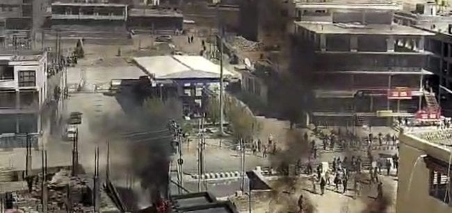 Smoke billows out from a structure set ablaze by miscreants amid a massive protest and shutdown, in Leh, Ladakh, Wednesday, Sept. 24, 2025. The protest was held in support of the demand to advance the proposed talks with the Centre on extension of Sixth Schedule as well as statehood to Ladakh.(PTI Photo)
