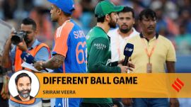 Pakistan's captain Salman Agha, right, walks past India's captain Suryakumar Yadav after the coin toss ahead of the Asia Cup cricket match between India and Pakistan at Dubai International Cricket Stadium in Dubai, United Arab Emirates, Sunday, Sept. 14, 2025. (AP Photo)