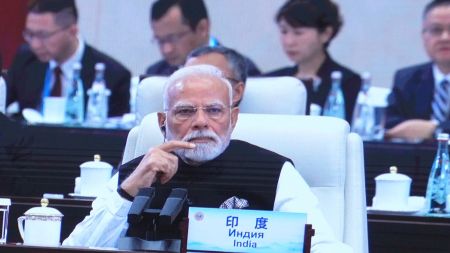Indian Prime Minster Narendra Modi is seen on a screen at the media centre during the opening ceremony of Shanghai Cooperation Organization (SCO) summit in Tianjin, China , Monday, Sept. 1, 2025.