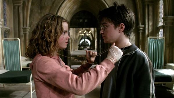 A still from the film adaptation of Harry Potter and The Prisoner of Azkaban, featuring Emma Watson as Hermione Granger and Daniel Radcliffe as the eponymous Harry Potter. 