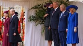 President Donald Trump salutes as he stands beside Britain's King Charles III and Queen Camilla with Melania Trump on the left as Britain's Kate and Prince William listen on the far left during the national anthem at Windsor Castle in Windsor, England, Wednesday, Sept. 17, 2025.(AP Photo/Kirsty Wigglesworth, Pool)