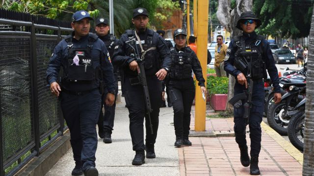 Police officers stand guard after being mobilized in Valencia, Venezuela, Thursday, Sept 11, 2025. (AP Photo/Jacinto Oliveros)