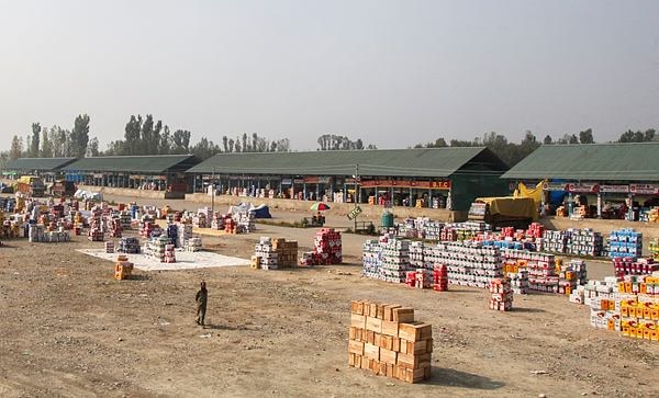 **EDS: RPT, ADDS CAPTION** Anantnag: Stacks of apple boxes lying at the fruit market that remains shut as growers protest against the 12-day highway closure, forcing traders to return trucks and demand urgent government action to save Kashmir’s fruit economy, at Jablipora, Anantnag district, Jammu and Kashmir, Monday, Sept. 15, 2025. (PTI Photo)(PTI09_15_2025_RPT078B)