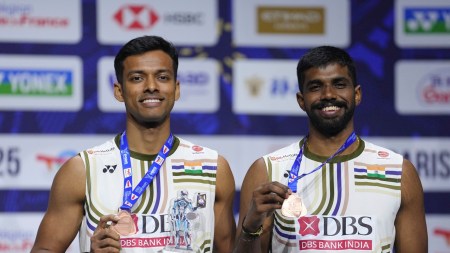 Chirag Shetty left, and Satwiksairaj Rankireddy pose on the podium after winning the Men's Doubles bronze medal at the Badminton World Championships (AP Photo)