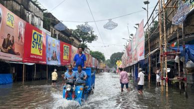 Water-logged streets across Shyambazar amid Durga Puja preparations.