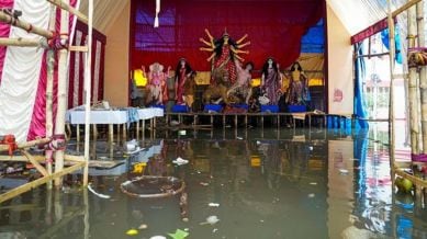 Idols of Goddess Durga placed on a raised structure after rainwater inundated the pandal, ahead of the 'Durga Puja' festival, in Kolkata, Tuesday, Sept. 23, 2025. (PTI Photo)