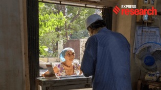Mehernosh Mullan, a fifth-generation shop owner on Princess Street, sells sandalwood sticks to a woman preparing to offer them to the Parsi sacred fire. (Rahul Patel)