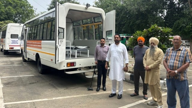 Mayor Amarjit Singh Jeeti Sidhu (in white kurta-pyjama) dedicates two new funeral vans, in Mohali on Wednesday.