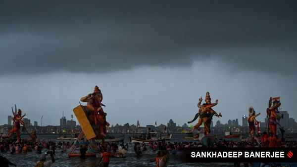 Devotees carry Ganesh idols for immersion in the Arabian Sea, on Ananta Chaturdashi (the 10th day of Ganesh Chaturthi festival), at Girgaon Chowpatty in Mumbai on Saturday, September 6. (Express photo by Sankhadeep Banerjee)