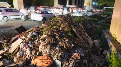 Commuters greeted by the heap of garbages lying under the metro line at Range hills on Friday.