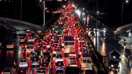 ehicles stuck in a traffic jam following rainfall, in Gurugram, Monday