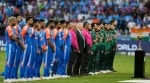Pakistan players, right, stand for their national anthem before the start of the Asia Cup cricket match between India and Pakistan at Dubai International Cricket Stadium in Dubai, United Arab Emirates, Sunday, Sept. 14, 2025. (AP Photo/Altaf Qadri)