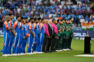 Pakistan players, right, stand for their national anthem before the start of the Asia Cup cricket match between India and Pakistan at Dubai International Cricket Stadium in Dubai, United Arab Emirates, Sunday, Sept. 14, 2025. (AP Photo/Altaf Qadri)